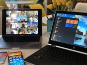 Das Bild zeigt Tablet und Laptop, mit geöffnetem Videkonferenzfenster - verschiedene Menschen winken aus ihren kleinen Bildschirmfenstern.
