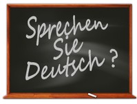 Das Bild zeigt eine gezeichnete Tafel auf der "Sprechen Sie deutsch" steht