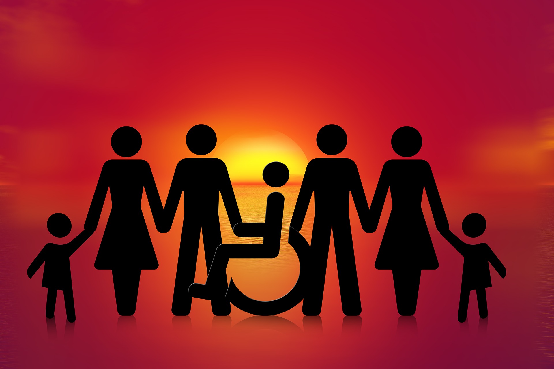 Das Bild zeigt eine Menschengruppe inklusive eines Rollstuhlfahrers und symbolisiert Inklusion.